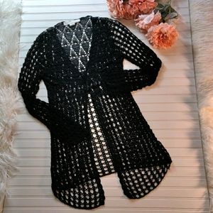 Black crocheted cardigan.